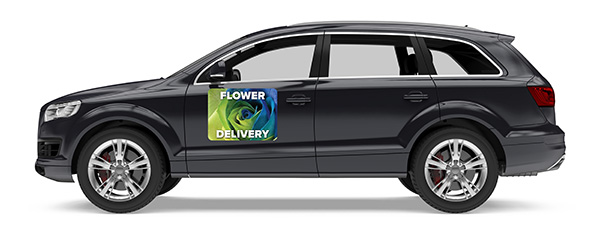 Green and blue car magnet with white text that says Flower Delivery featured on a black crossover vehicle